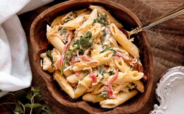 Pasta salad on brown wooden bowl