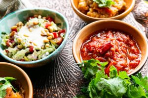 Bowls with tasty vegetable salad and meat stew