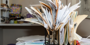 Messy clutter of files on a desk