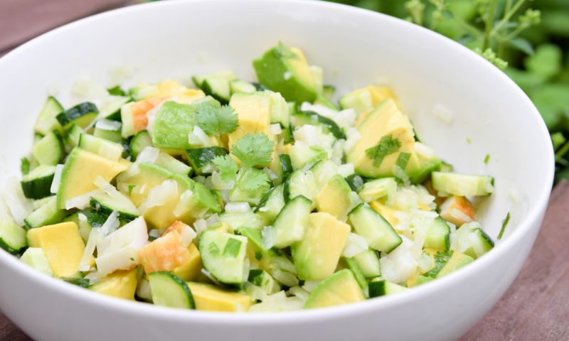 Bowl of chopped cucumber avocado salad