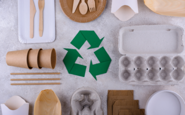 Image of reusable brown picnic items and a green recycle symbol