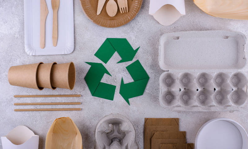 Image of reusable brown picnic items and a green recycle symbol