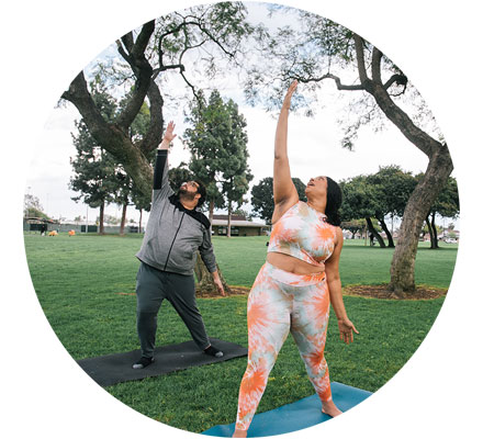 Two people exercising outside