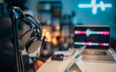 Image of podcast studio with headphones and microphone