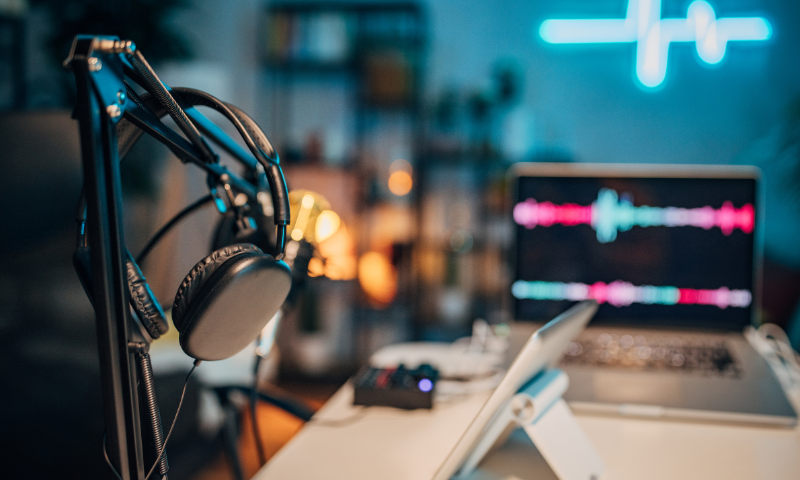 Image of podcast studio with headphones and microphone